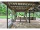 Outdoor patio featuring a bar, table, and fan that provides the perfect spot for relaxing and entertaining at 5113 Cedar Ln, Brooksville, FL 34601