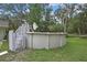 Above-ground pool in a spacious backyard, ready for summer fun and relaxation at 5113 Cedar Ln, Brooksville, FL 34601