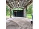 Enclosed storage shed, featuring a metal roof and sliding door, with durable brick paving under the covered area at 5113 Cedar Ln, Brooksville, FL 34601