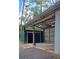 Durable metal shed, open on one side, featuring a lean-to and secure storage room for equipment and tools at 5113 Cedar Ln, Brooksville, FL 34601