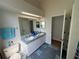 Bathroom with dual sinks, blue tile accents, and a well-lit vanity area at 5294 Elkin Ave, Spring Hill, FL 34606