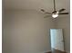 Bedroom featuring neutral walls, hardwood floors, ceiling fan, and a closet at 5294 Elkin Ave, Spring Hill, FL 34606