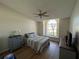 Cozy bedroom features a ceiling fan, hardwood floors, and a charming window seat at 5294 Elkin Ave, Spring Hill, FL 34606