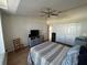 Bedroom featuring hardwood floors, ceiling fan, and large closet at 5294 Elkin Ave, Spring Hill, FL 34606