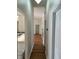 Bright hallway featuring hardwood flooring and access to the kitchen and other rooms at 5294 Elkin Ave, Spring Hill, FL 34606