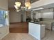 Open-concept kitchen with a view of the living area and a full suite of appliances at 5294 Elkin Ave, Spring Hill, FL 34606