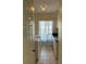 Well-lit laundry room with washer, dryer, storage cabinets, and a tiled floor at 5294 Elkin Ave, Spring Hill, FL 34606