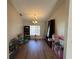 Large playroom area with toys, hardwood floors, chandelier, and natural light at 5294 Elkin Ave, Spring Hill, FL 34606