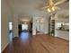Bright, open-concept living room with hardwood floors, high ceilings, and modern decor at 5294 Elkin Ave, Spring Hill, FL 34606