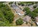 An aerial view of backyard of home showing the fence and partial view of the neighborhood at 6125 Desert Peace Ave, Land O Lakes, FL 34639