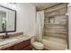 This functional bathroom offers a shower and tub combination, a marble-style vanity, and modern fixtures at 6125 Desert Peace Ave, Land O Lakes, FL 34639