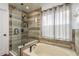 Relaxing bathroom features a soaking tub, separate glass-enclosed shower, and tasteful wood-look tile surround at 6125 Desert Peace Ave, Land O Lakes, FL 34639