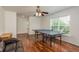 Game room features hardwood floors, natural light, and ample space for recreation and relaxation at 6125 Desert Peace Ave, Land O Lakes, FL 34639