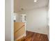Hallway with hardwood flooring with neutral paint leads to other rooms in the house at 6125 Desert Peace Ave, Land O Lakes, FL 34639