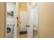 Laundry room with washer and dryer connections, and access to adjacent half bathroom at 6125 Desert Peace Ave, Land O Lakes, FL 34639