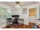 Office has dual monitors with hardwood floors, natural lighting, and is perfect for remote work at 6125 Desert Peace Ave, Land O Lakes, FL 34639