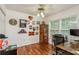 Office with desk space, hardwood floors, and lots of natural light from the bright window at 6125 Desert Peace Ave, Land O Lakes, FL 34639