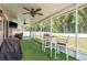 Enjoy the outdoors on this large screened lanai with seating and views of the fenced in yard at 6125 Desert Peace Ave, Land O Lakes, FL 34639