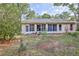 Backyard view of the home featuring grass and foliage surrounding the home at 6172 Prestwick Ct, Spring Hill, FL 34606