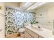 Bathroom with shower and tub, vanity with sink and decorative butterfly at 6172 Prestwick Ct, Spring Hill, FL 34606