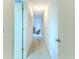 Hallway with white walls and doors that lead to other rooms and a closet at 6172 Prestwick Ct, Spring Hill, FL 34606