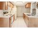 Functional kitchen featuring updated appliances, ample counter space, and bright lighting at 6172 Prestwick Ct, Spring Hill, FL 34606