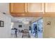 Open living room with view from the kitchen showcasing comfortable seating and bright natural light at 6172 Prestwick Ct, Spring Hill, FL 34606