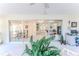 Bright sun room featuring sliding glass doors with views to the home's interior at 6172 Prestwick Ct, Spring Hill, FL 34606