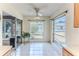 Bright sunroom with tiled flooring, multiple windows, and views of the backyard and natural light at 6172 Prestwick Ct, Spring Hill, FL 34606
