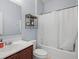 Bathroom features a tub, shower, and single sink vanity at 6273 Pinehurst Dr, Spring Hill, FL 34606