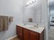 Bathroom features a double sink vanity and large mirror at 6273 Pinehurst Dr, Spring Hill, FL 34606