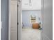 View of carpeted bedroom through doorway at 6273 Pinehurst Dr, Spring Hill, FL 34606