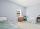 Bedroom with carpet floors, a window, and a wood dresser at 6273 Pinehurst Dr, Spring Hill, FL 34606
