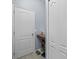 Hallway with tiled floors and a pantry for storage at 6273 Pinehurst Dr, Spring Hill, FL 34606