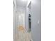 Hallway with carpet floors leads to the walk-in closet and another room at 6273 Pinehurst Dr, Spring Hill, FL 34606