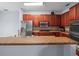 Modern kitchen with stainless steel appliances, countertops, and ample cabinet space at 6273 Pinehurst Dr, Spring Hill, FL 34606