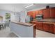 Open kitchen with breakfast bar and stainless steel appliances at 6273 Pinehurst Dr, Spring Hill, FL 34606