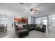Open concept living room boasts wood floors, adjacent dining, and a modern kitchen at 6273 Pinehurst Dr, Spring Hill, FL 34606