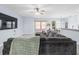 Comfortable living room features a large sectional sofa and a mounted flatscreen television at 6273 Pinehurst Dr, Spring Hill, FL 34606