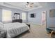 Spacious main bedroom features tray ceilings, neutral carpet, and modern ceiling fan at 6273 Pinehurst Dr, Spring Hill, FL 34606