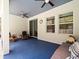This screened patio features ceiling fans, comfortable seating, and a serene, shaded atmosphere at 6273 Pinehurst Dr, Spring Hill, FL 34606