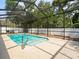 A refreshing screened-in pool offers a perfect spot for relaxation and fun at 6273 Pinehurst Dr, Spring Hill, FL 34606