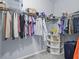 Walk-in closet with clothing racks and storage shelves at 6273 Pinehurst Dr, Spring Hill, FL 34606