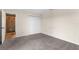 This carpeted bedroom features a closet, en suite bathroom, and neutral wall color at 6321 Garland Ct, New Port Richey, FL 34652