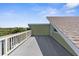 Large wooden deck with scenic views under blue skies at 6321 Garland Ct, New Port Richey, FL 34652
