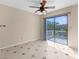 Bright dining area features a ceiling fan and sliding glass doors leading to a private deck at 6321 Garland Ct, New Port Richey, FL 34652