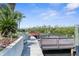 Scenic view of dock with wood railings and waterfront access at 6321 Garland Ct, New Port Richey, FL 34652