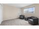 Neutral living room with window view and cozy sitting area at 6321 Garland Ct, New Port Richey, FL 34652