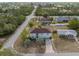 Aerial view of home highlighting surrounding neighborhood and proximity to lush greenery at 6440 Curtiss Ln, Spring Hill, FL 34609