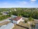 Expansive aerial view of the home showcasing the mature landscaping and the home's proximity to the neighborhood at 6440 Curtiss Ln, Spring Hill, FL 34609